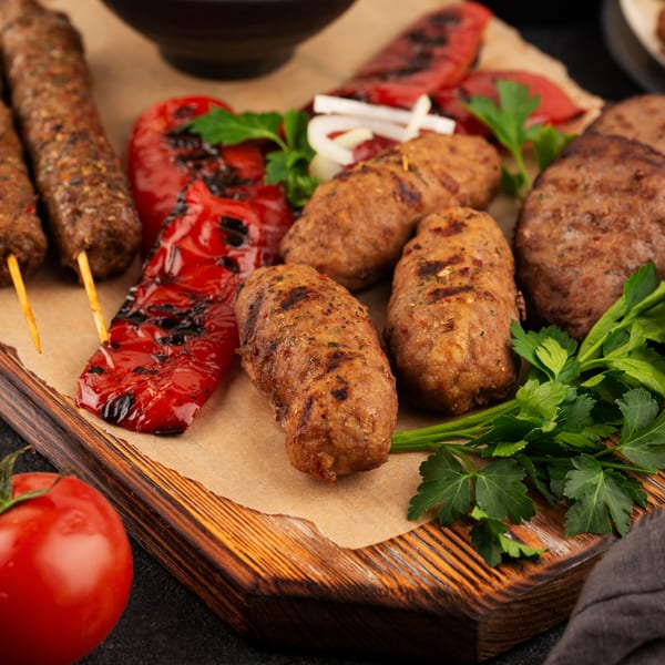 Shahi Restaurant's Indian grilled kebabs, sausages, and patties with roasted red peppers and fresh parsley.