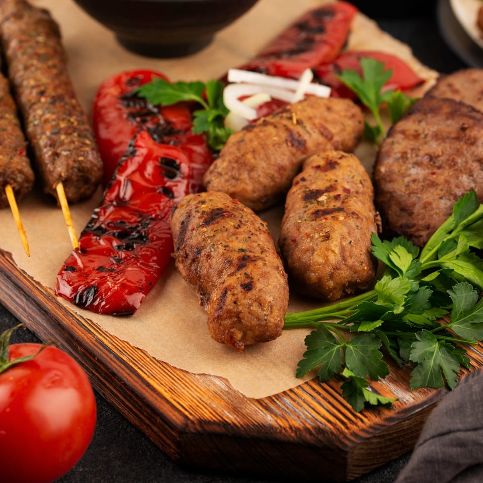 Shahi Restaurant's Indian grilled kebabs, sausages, and patties with roasted red peppers and fresh parsley.